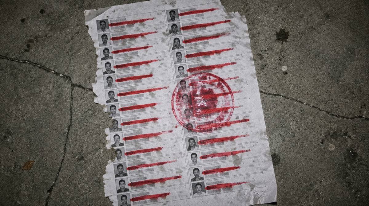 Torn voter roll with names struck off in red ink and an official stamp